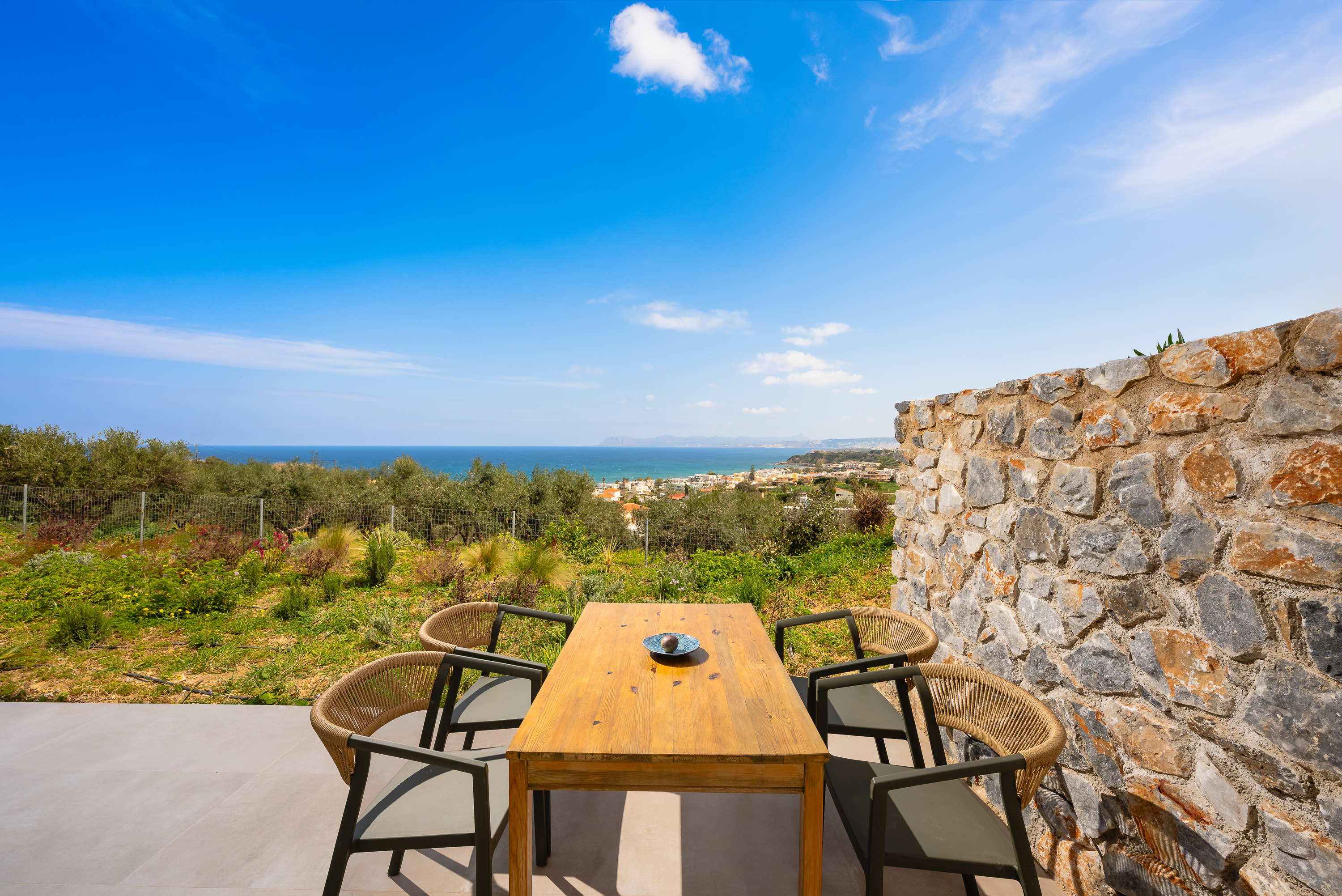 Dining terrace with coastal view